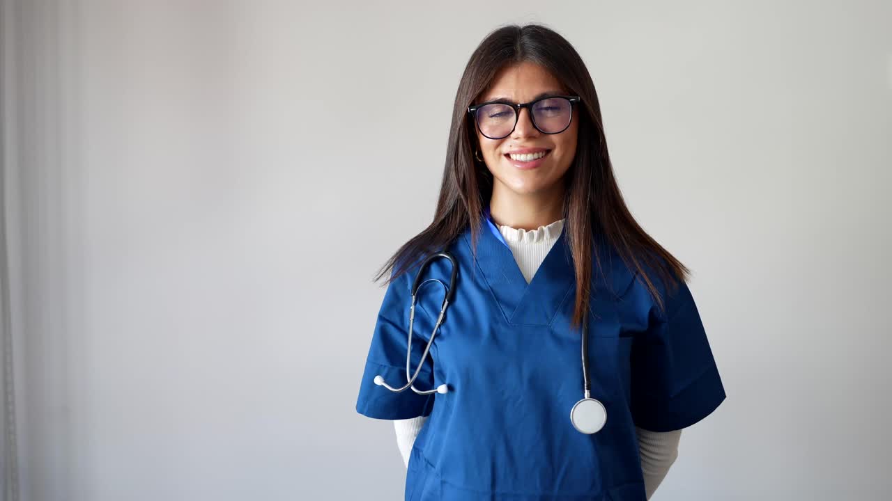 Portrait of a Smiling Nurse in Scrubs