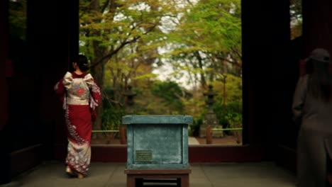 japanese temple garden with women in kimonos