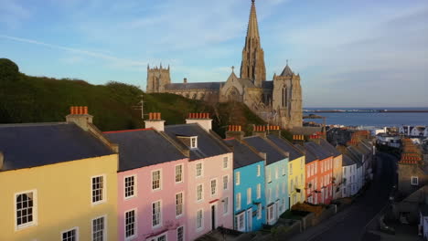colorful houses and a grand cathedral overlooking a coastal town