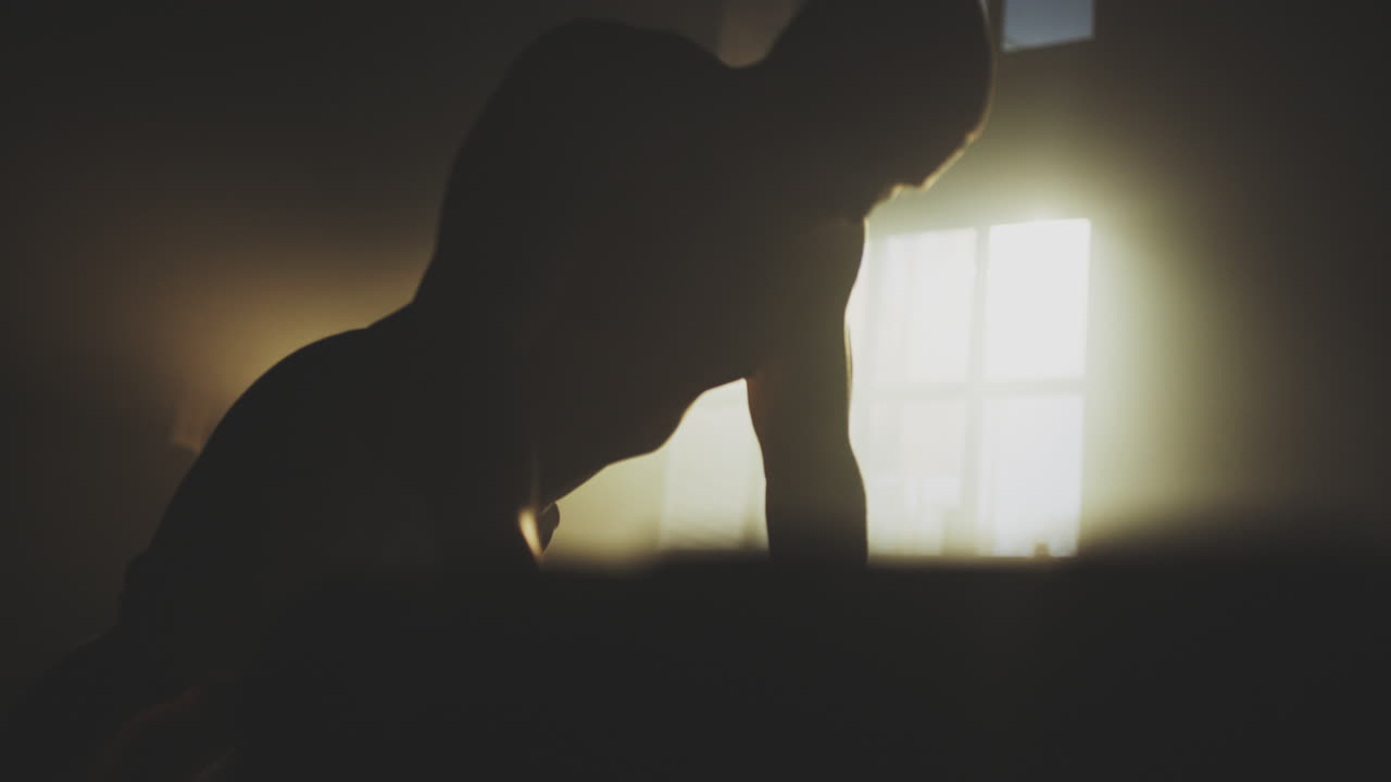 Man Doing Push-ups in a Dark Gym