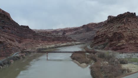 Arches-National-Park,-Utah---River-Flowing-in-Beautiful-Valley,-Aerial