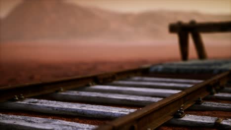 abandoned railway tracks in the desert