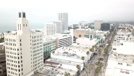 4K-Panning-Aerial-Drone-shot-of-Santa-Monica,-California-with-the-Pacific-Ocean-and-Pier-in-the-Background-on-a-Cloudy-day