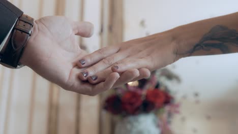 Slow-motion-shot-of-a-bride-doing-a-handshake-with-a-guest-with-a-bouquet-of-flowers