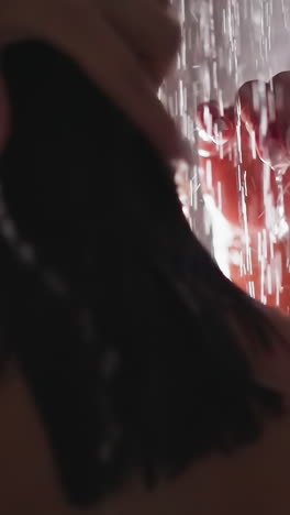 woman does hair wash in shower water closeup. brunette lady cleans short wet hair in bathroom. comfortable hygienic routine and body-wash procedures