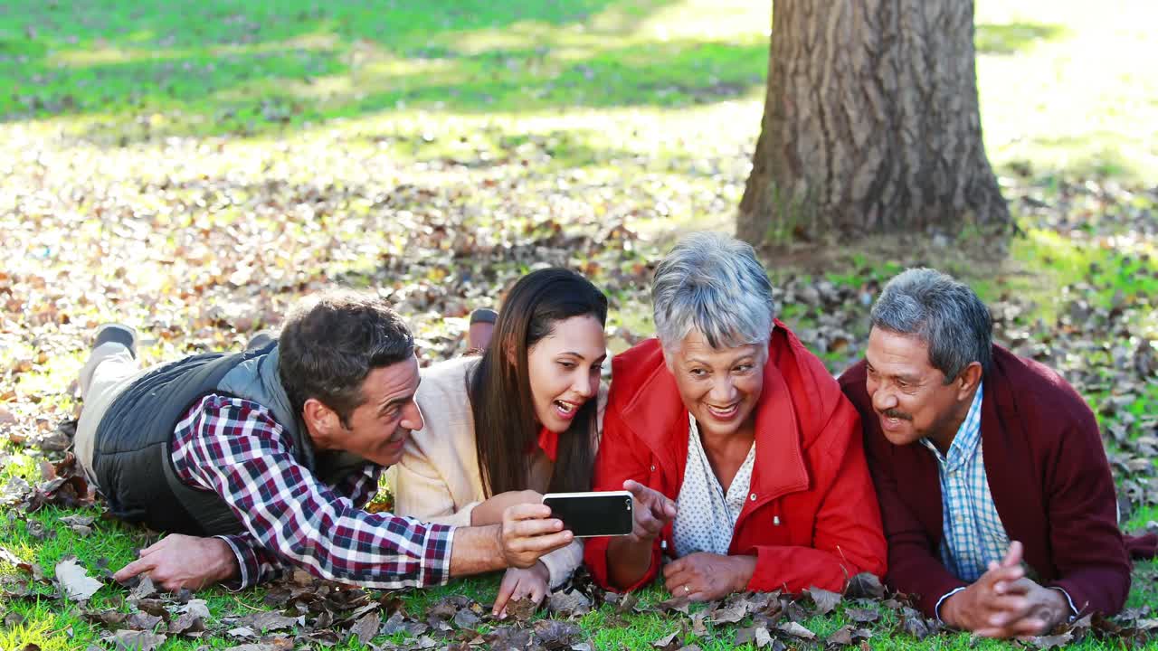 Family taking selfie in the park