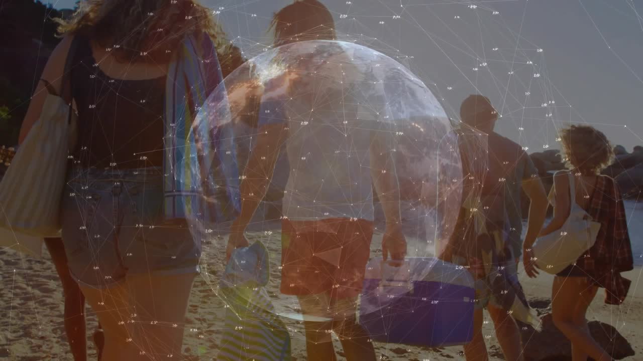 Group entering frame and walking to shore for leisure, man carrying cooler rotating tech globe