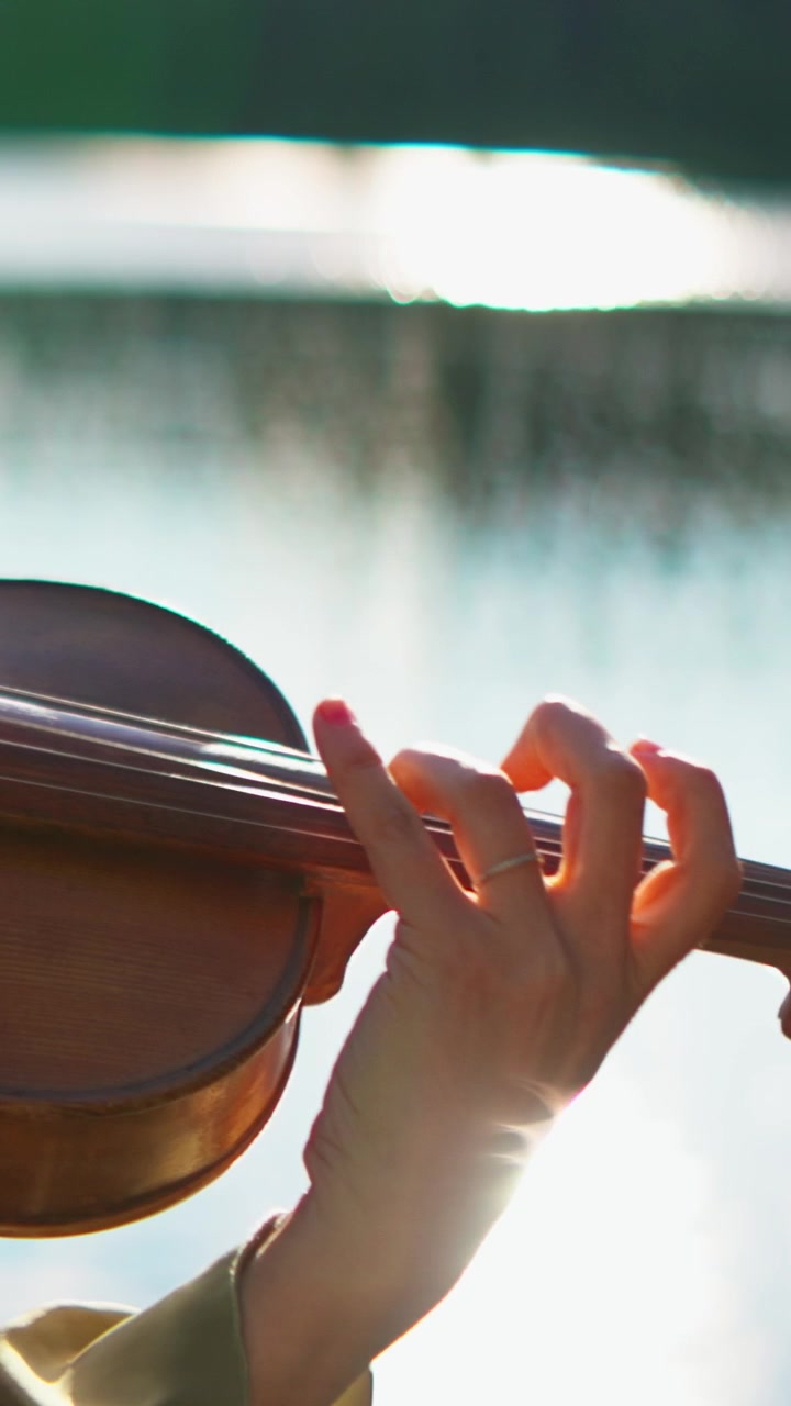 Close-up of a Musician Playing the Violin Outdoors