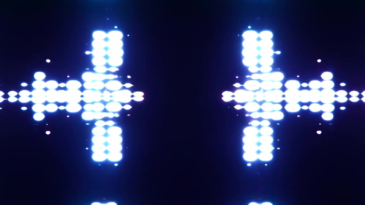 Brillanti grappoli luminosi blu formano un motivo simmetrico ed equilibrato su uno sfondo scuro, creando una scena astratta futuristica con forte contrasto.
