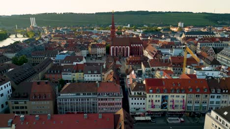 4k aerial drone video of the market plaza water fountain and st mary's chapel in downtown würzburg, germany