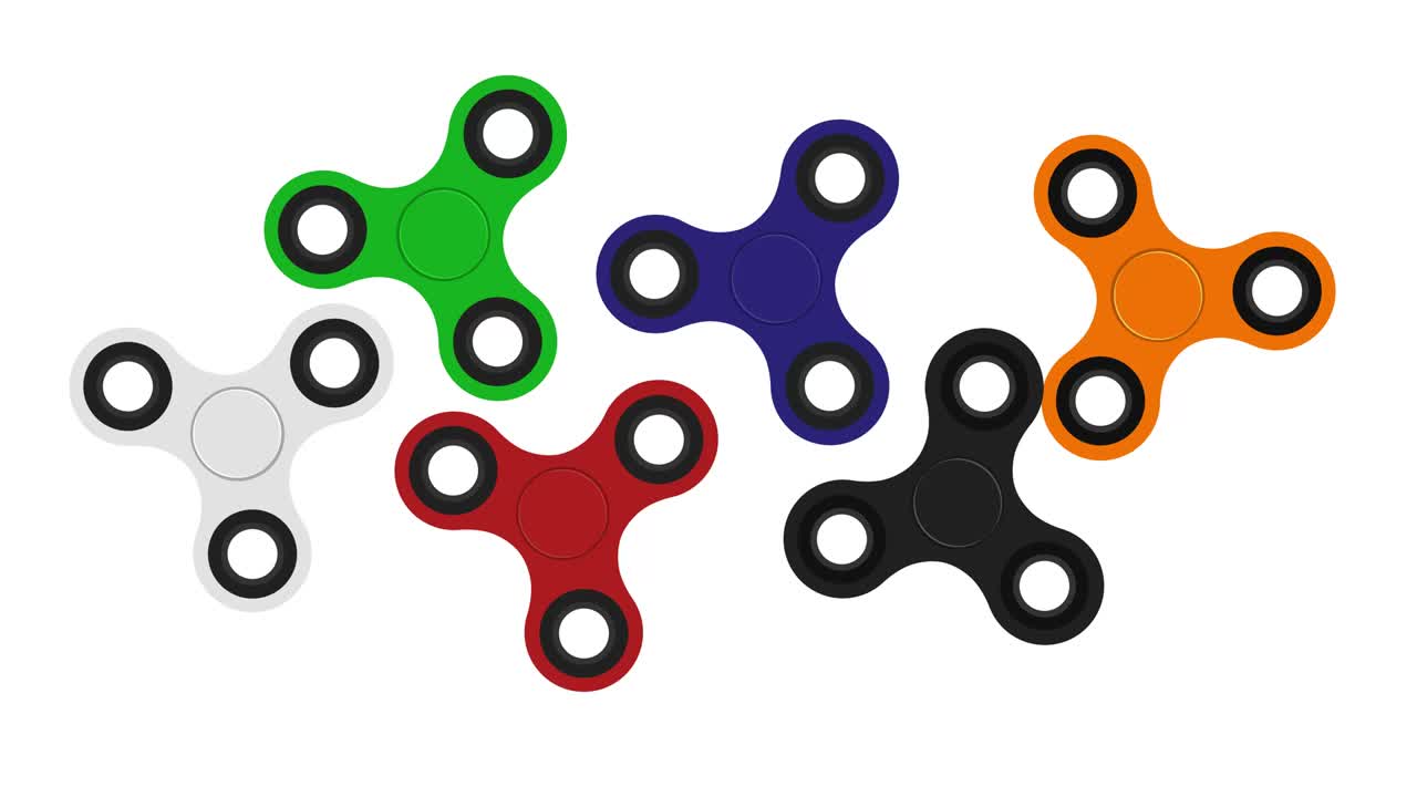 Colored hand spinners spinning on a white background. A toy for concentration. Motion graphics.