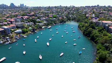 Drone-aerial-scenic-view-Mosman-Bay-Cremorne-Point-North-Sydney-Neutral-bay-yachts-boats-dock-Sydney-City-harbour-urban-housing-apartment-residential-wharf-sea-NSW-Australia-4K