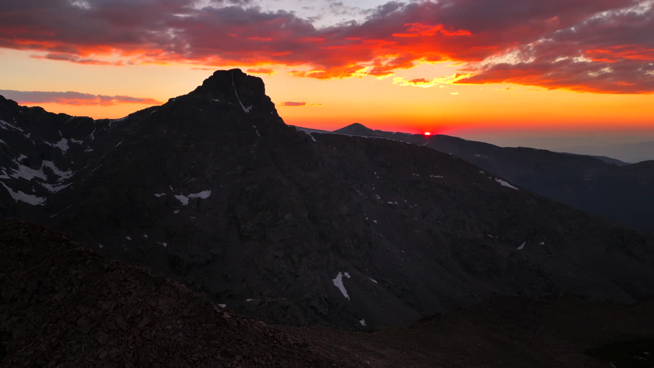 Mount of the Holy Cross Halo Ridge Colorado 14er peak Sawatch Range parallax aerial drone Vail Minturn golden hour vibrant sunset on Rocky Mountains horizon Notch Mountain shelter circle right motion