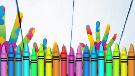 animación de lápices de colores sobre manos formadas con rompecabezas