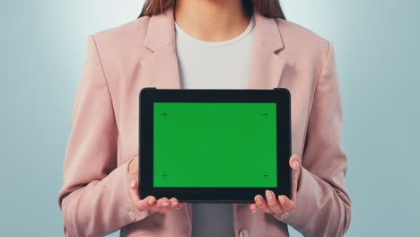 tablet, green screen and hands of woman in studio