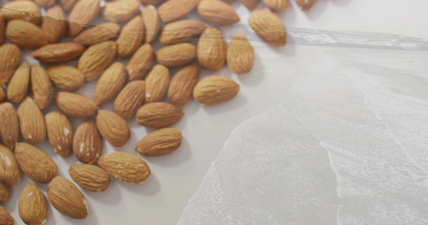 Vidéo verticale : Caméra changeant de mise au point sur des amandes dans une assiette, révélant la texture sur une fine pellicule.