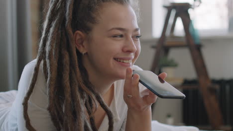joyful woman recording voice message