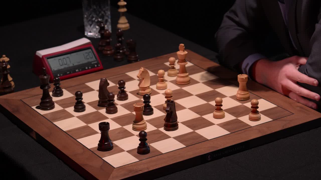 Quick sequence of chess moves and captures, trading rooks on wooden chess board with tournament clock