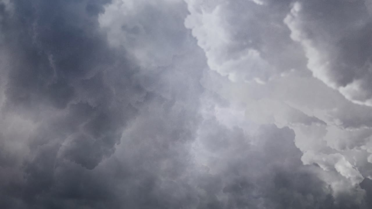 Dark clouds and a thunderstorm occurs inside the dark sky