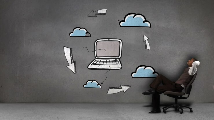 Businessman sitting in front of animated cloud computing