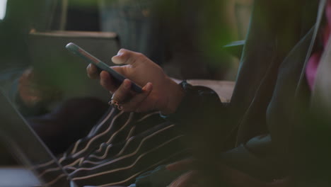 close-up-young-students-hands-using-smartphone-working-together-on-college-project-studying-browsing-online-research-enjoying-social-media-sharing-creative-ideas-in-relaxed-office