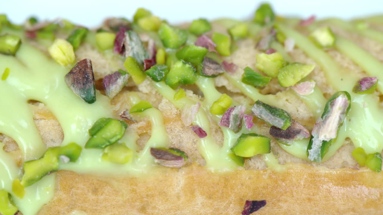 White eclair dessert with fistic nuts and cream