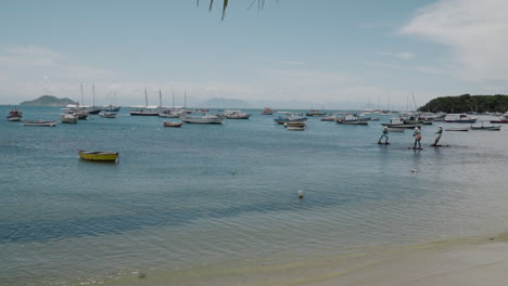 shot of boats at buzios bay - rio de janeiro