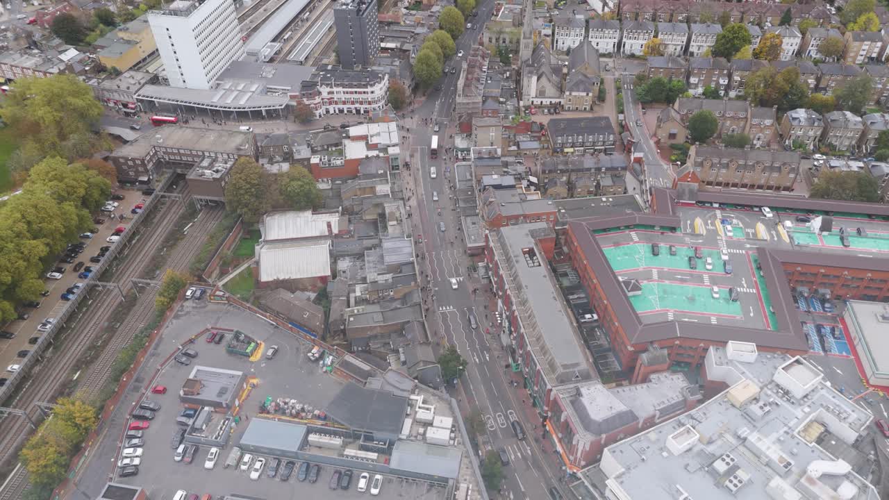 Drone perspective of The Broadway urban center revealing commercial and community infrastructure in Ealing, London, UK, October 2024