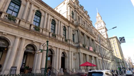 tram moving past historic gpo building