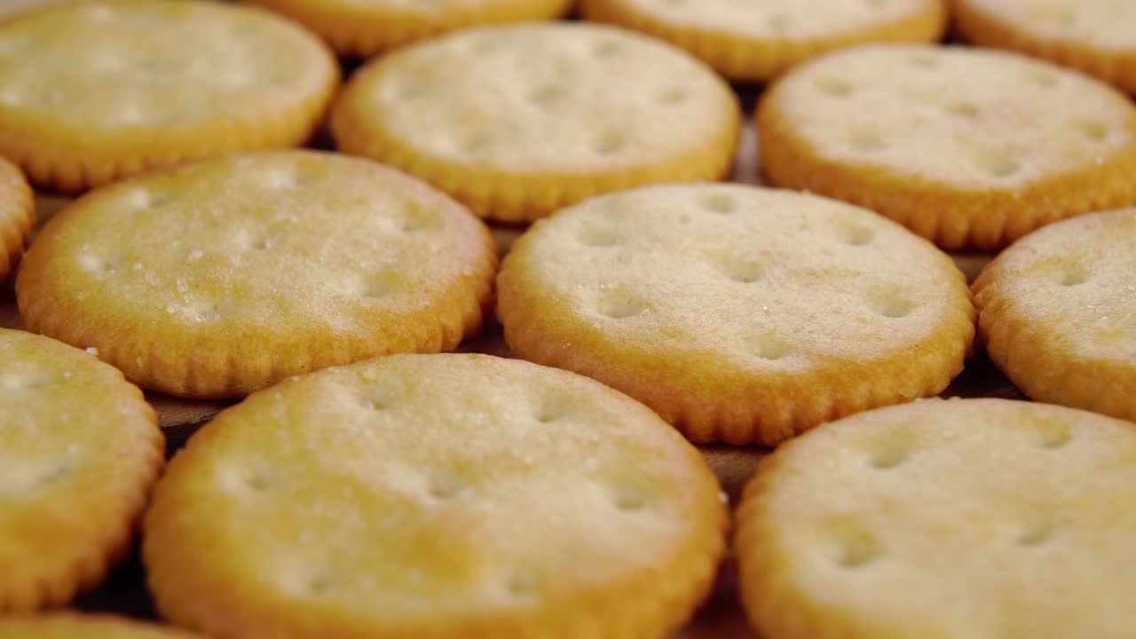 Dry tasty crispy crackers. Thin round cookies. Macro