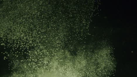 a big cloud of white powder falling trough water in slow motion.