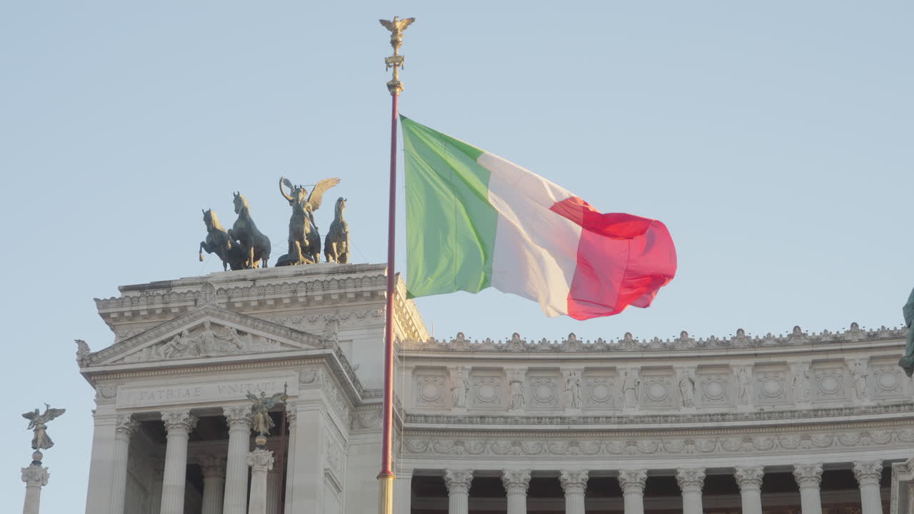 Italian flag and statues of Monument to Vittorio Emanuele II, Rome, Italy