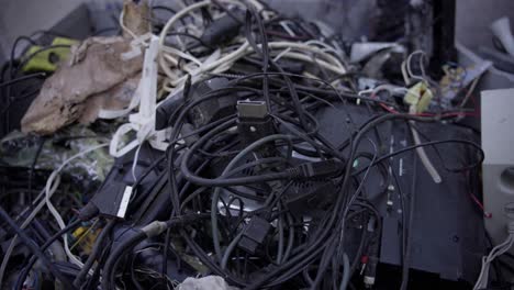 Large stack of recycling electronic waste, different cables and wires with adapters, dedication to environmental protection and the pursuit of a cleaner and more sustainable technological landscape