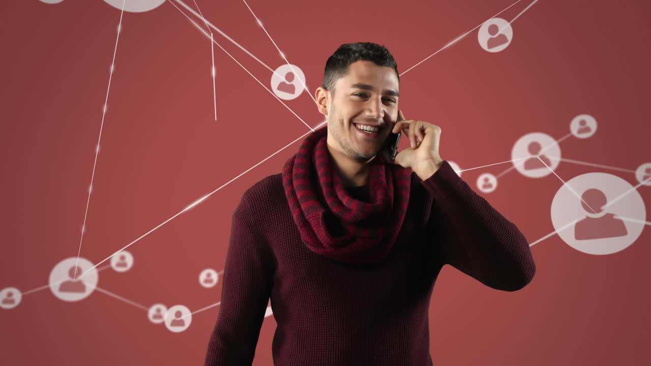 animación de un hombre biracial hablando en su teléfono inteligente con conexiones de red de personas iconos flo