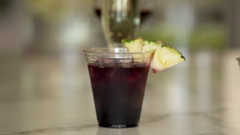 grabbing selections of mixed alcoholic drinks at a spa bar