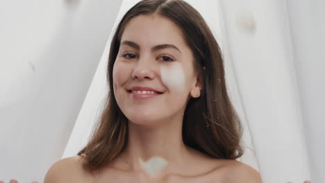 slow-motion-portrait-beautiful-young-woman-rose-petals-falling-on-attractive-female-smiling-enjoying-luxury-between-sheets-in-white-background-beauty-concept