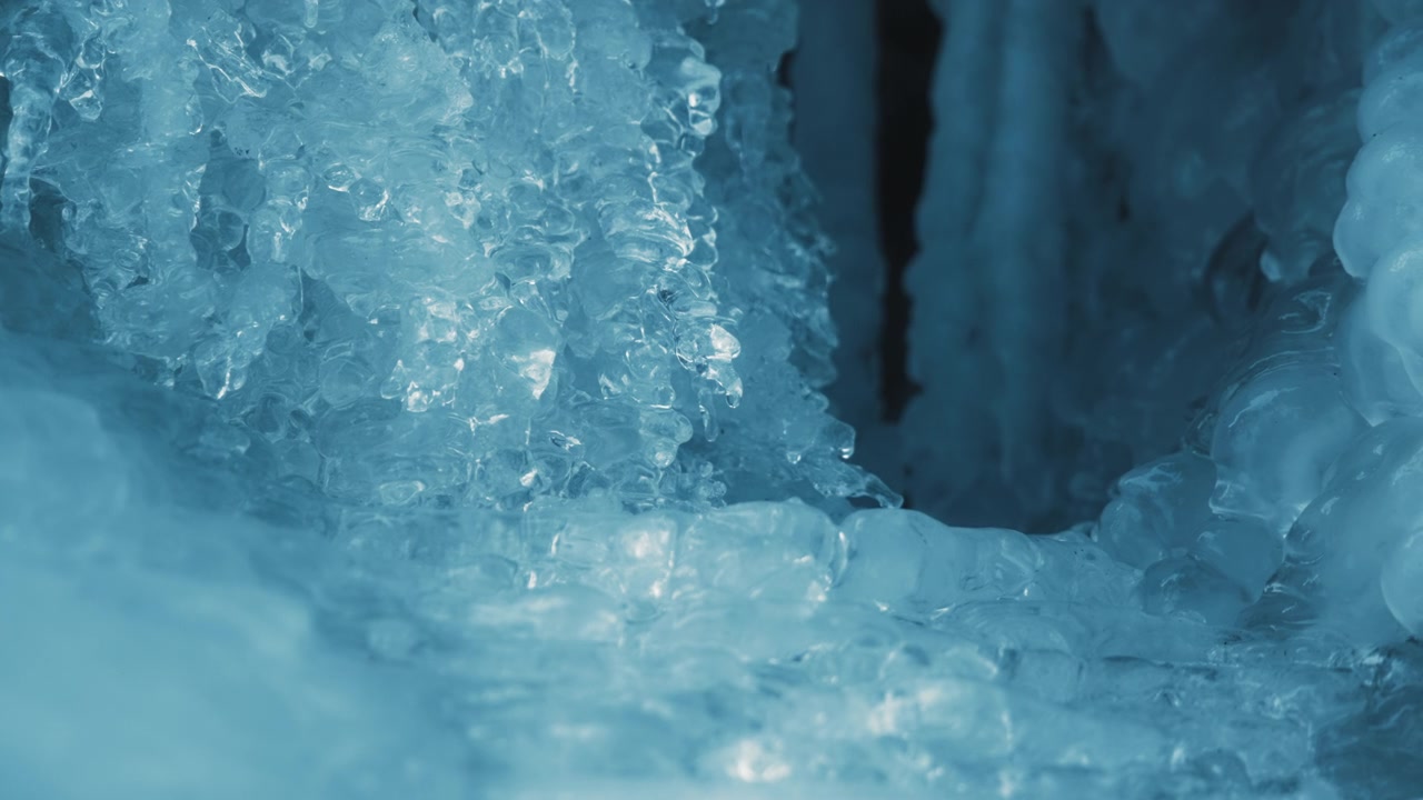 Icicles of frozen waterfall melting