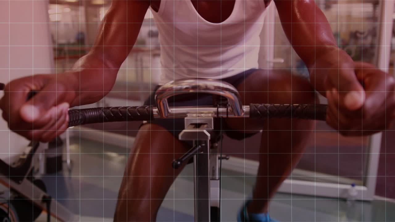 Man gripping bars, pedaling bike, camera rising revealing face, teal equalizer tracking fitness