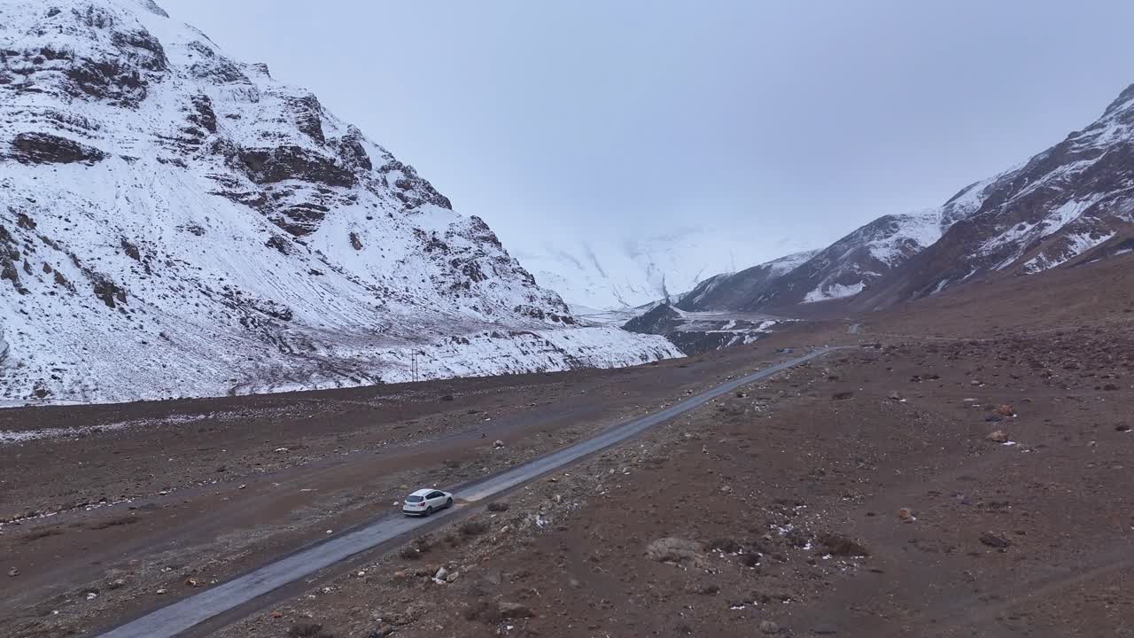Snowy Mountain Road with Car