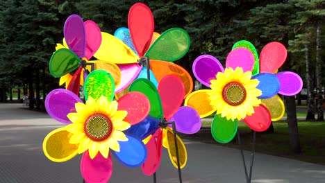 colorful pinwheels or windmill rotates in the wind.