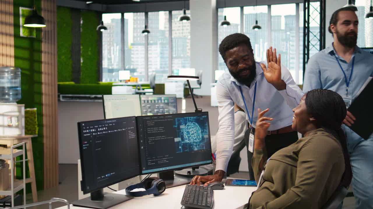 Cheerful Programmers In Office Enjoying Conversation While Automating With Ai