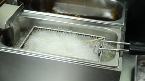 commercial deep fryer in operation