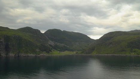 beautiful green hills of coastal island of maloy norway - wide shot