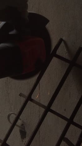 cutting steel with angle grinder in workshop