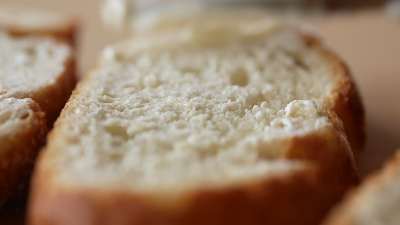Butter spreading on bread