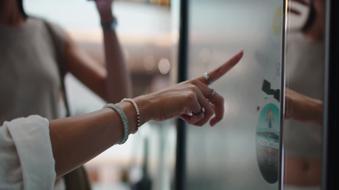 Woman interacting with a touchscreen display