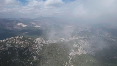 aerial-view-of-Dramatic-skies-over-Cloudy-mountains-drone-panoramic-shot-of-Thermessos,-Antalya,-Turkey