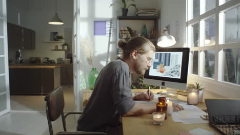 designer working at cozy home workplace