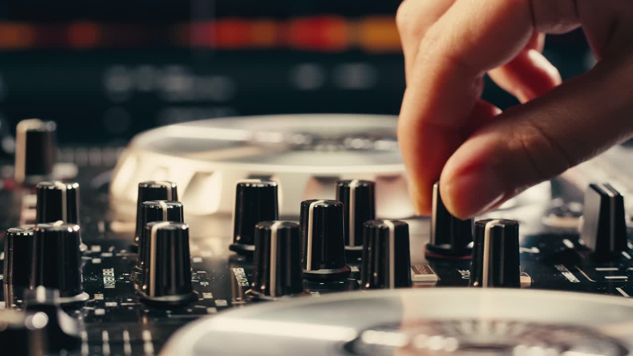 DJ with headphones and sunglasses playing music on festival in night club. Techno musician performing at nightclub for concert crowd of people, city bar.