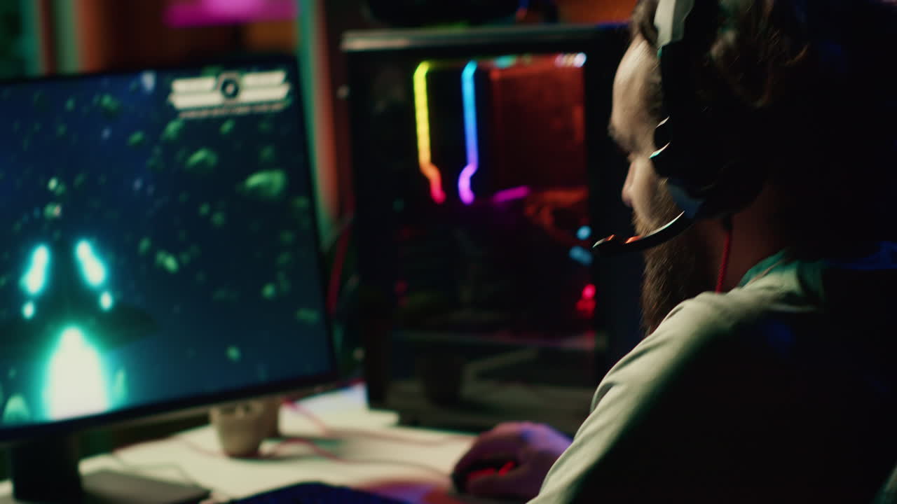 Close up shot of computer screen showing spaceship flying singleplayer